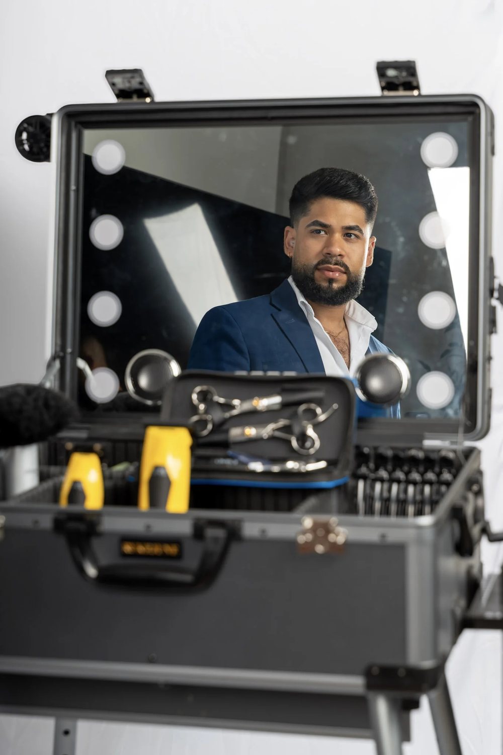 David Caridad's station — mirror, shears, and clippers prepared