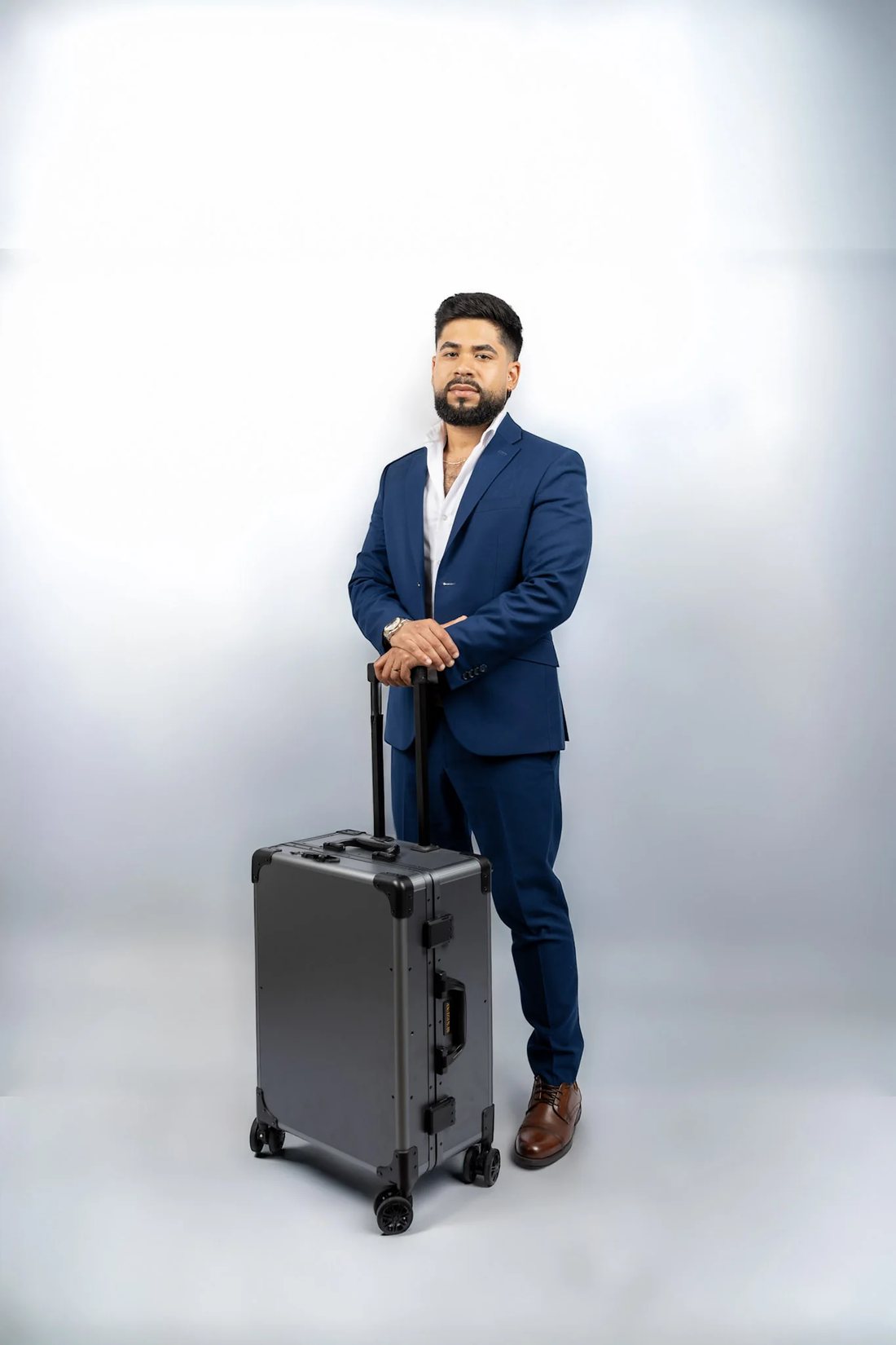 David Caridad, private barber, photographed with his travel grooming case